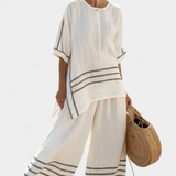 Salopeta s širokim prugama i asimetričnim rezom - moderno i udobno stil